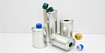 Why are high-end olive oils increasingly being packaged in tin metal cans?